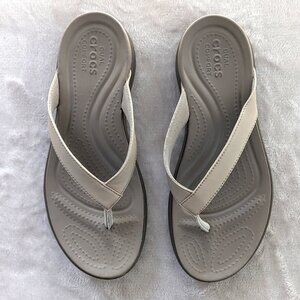 crocs sandal, flip flop, tan in color size womens 7